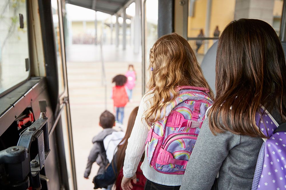 Kids coming off the bus